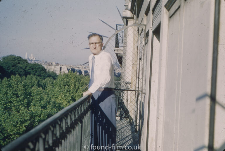 Man on the balcony of a hotel