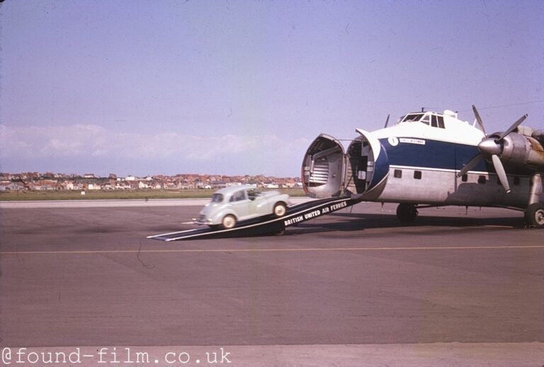 morris-minor-being-driven-onto-a-cargo-plane-about-1964.jpg