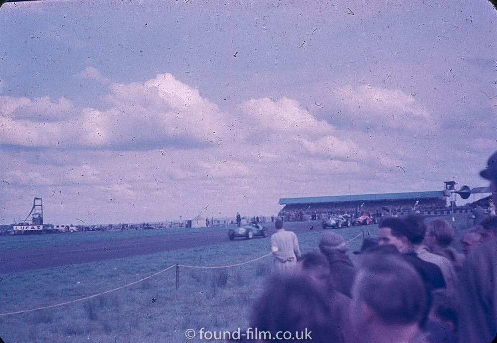 Multiple cars at 1950s Motor race