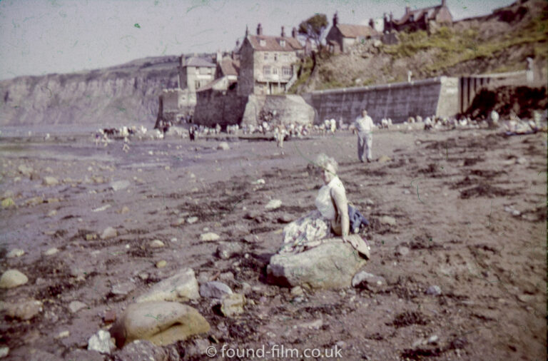 Old seaside snap of a woman on a beach