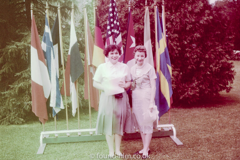 Portrait in front of flags