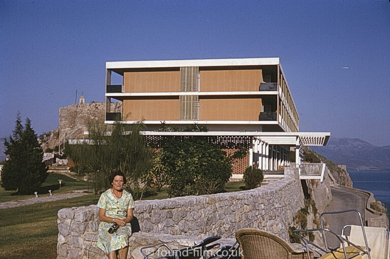 Woman posing by holiday home or hotel in September 1966