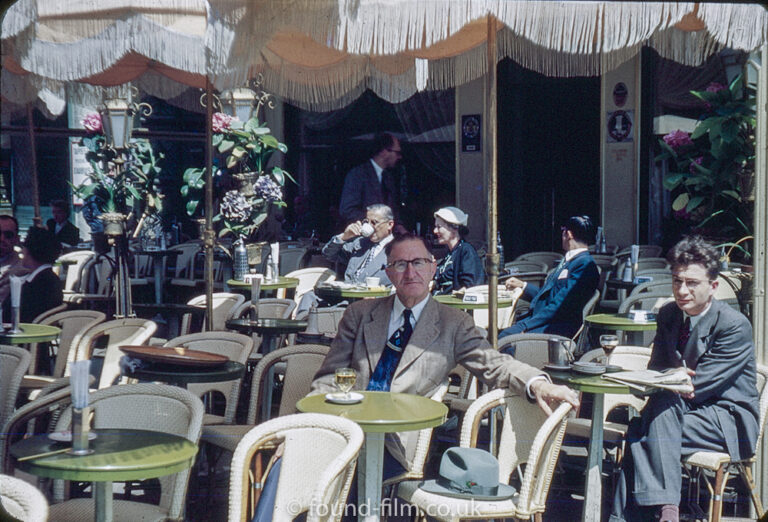 Relaxing in a cafe on a sunny day in the 1950s