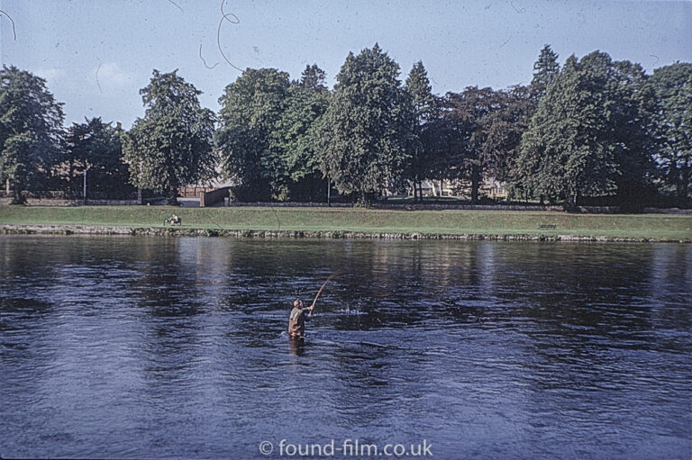 Salmon Fisher in a river in Scotland – probably Inverness.