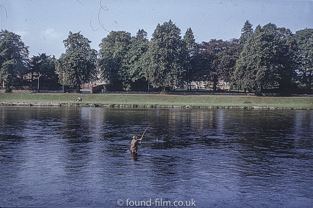 Salmon Fisher in a river in Scotland - probably Inverness.