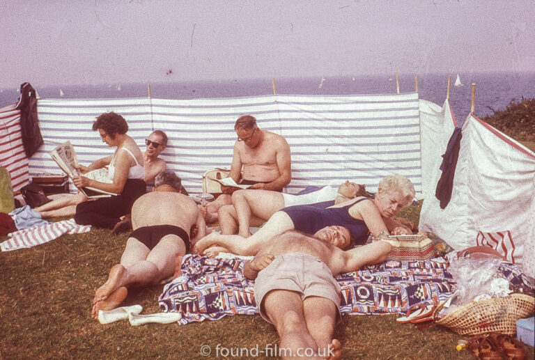 A Seaside group behind a windbreak