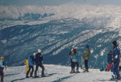 skiers on top of a mountain
