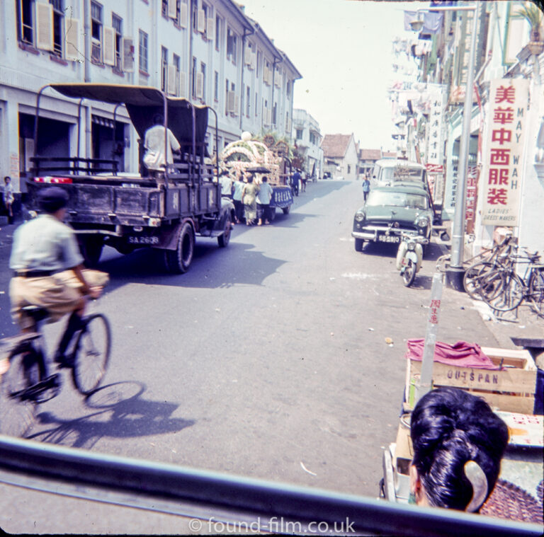 Snapshot of Singapore street through a car window, 1960s