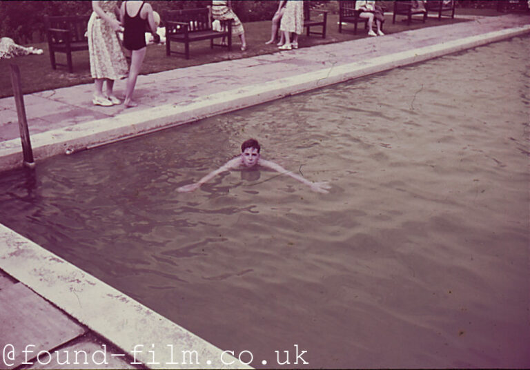 A Boy swimming in a pool