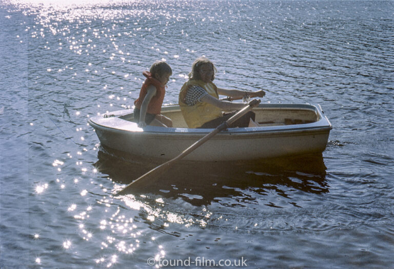 Two children in a row boat