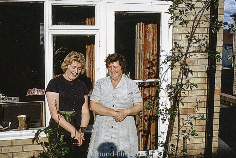 Two ladies by their window in June 1966