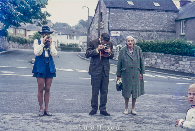 Two photographers taking pictures at a wedding