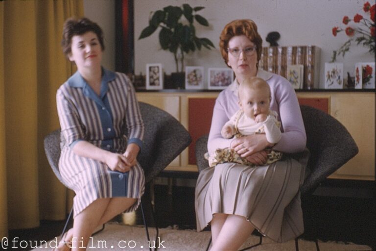 Two women and a baby in a 1950s interior, 1958