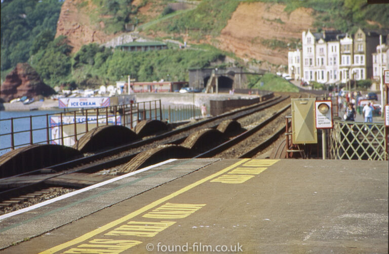 Dawlish railway station with track disappearing into tunnel.