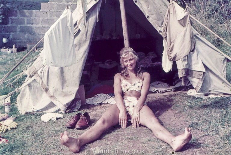 Woman 1 outside tent