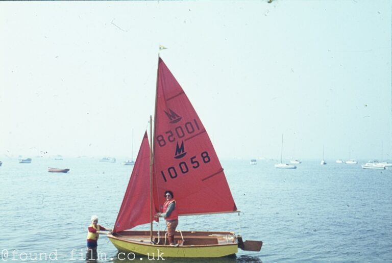 Woman and child with a sailing dinghy – 1960s