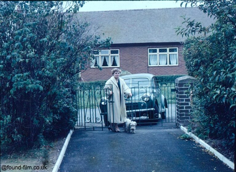 Woman and Dog at Garden Gate