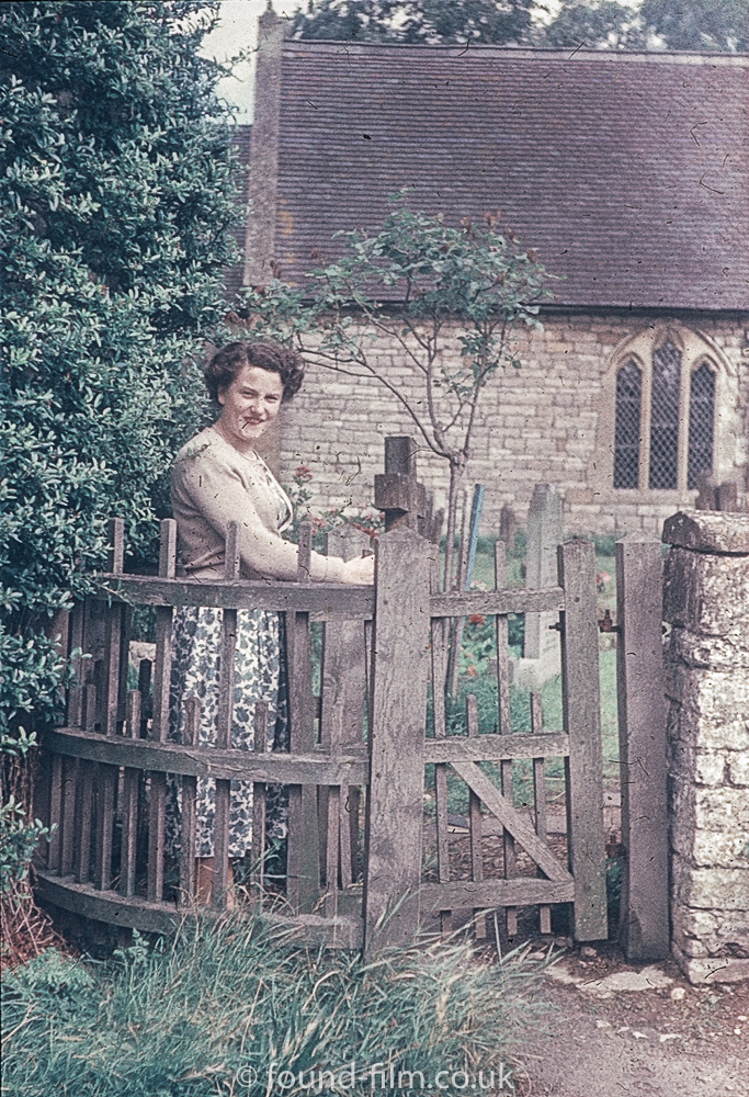 Woman standing by church gate