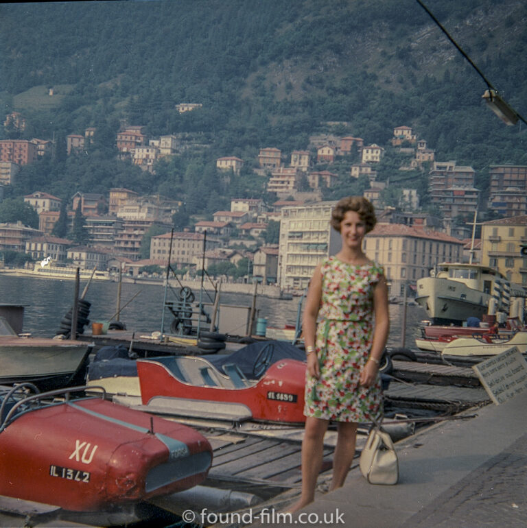 Woman standing by speed boats on Swiss Lake