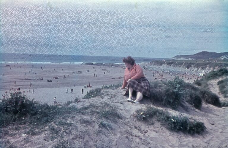 Woman looking out over a beach