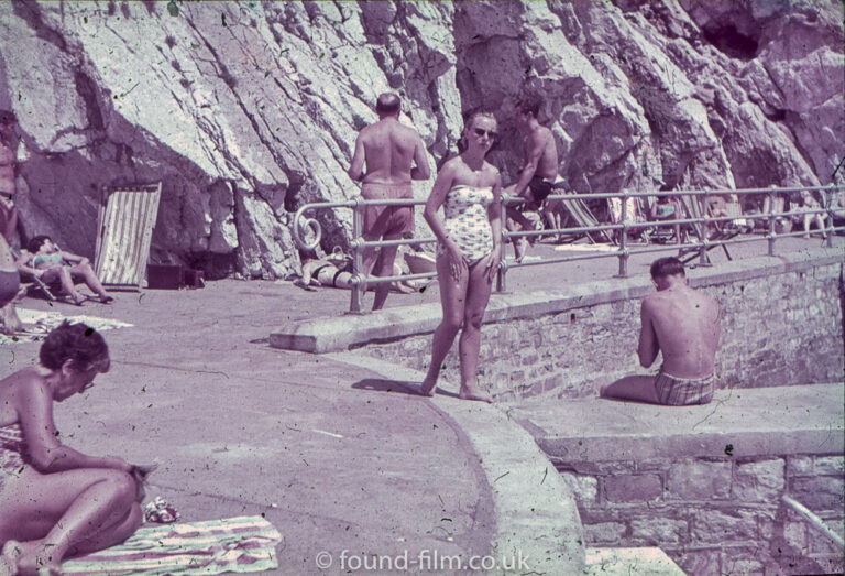 woman-on-beach-in-sunglasses