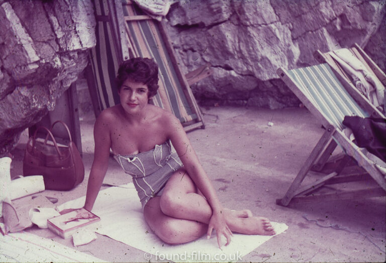 Woman posing on beach