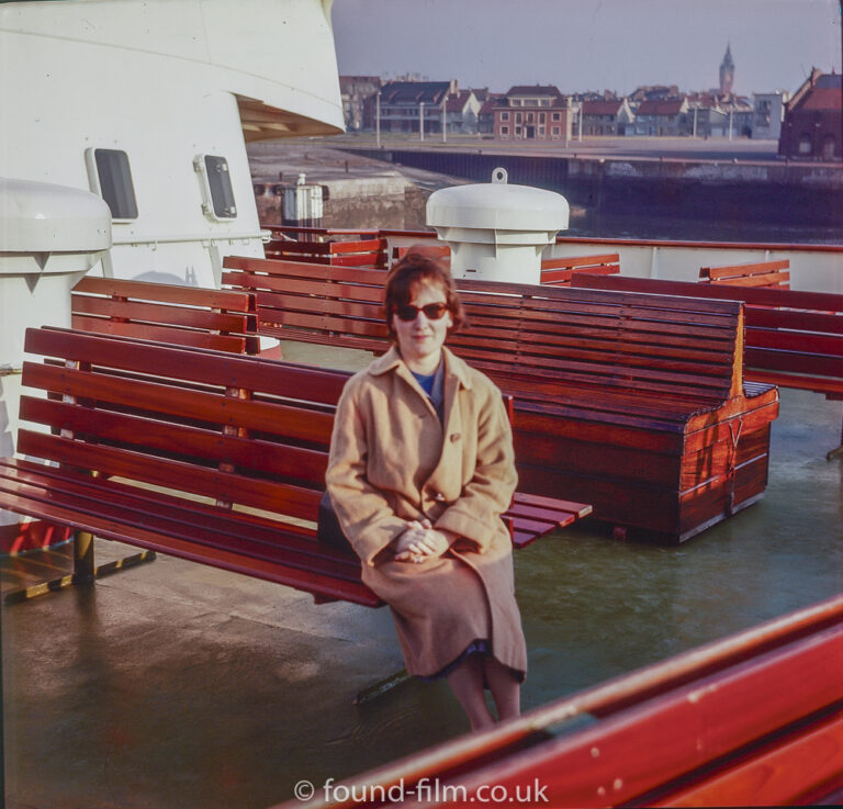 Woman seated on a boat, late 1950s