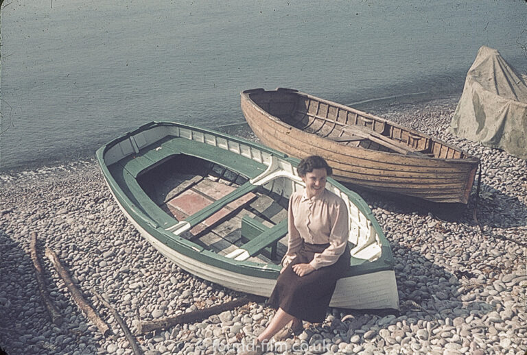 Woman sitting on the side of a boat