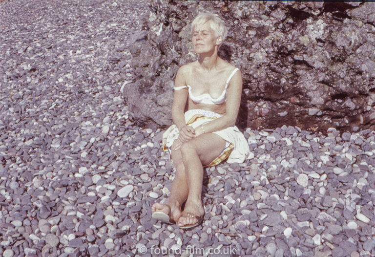 Woman sunbathing on a beach – 1968