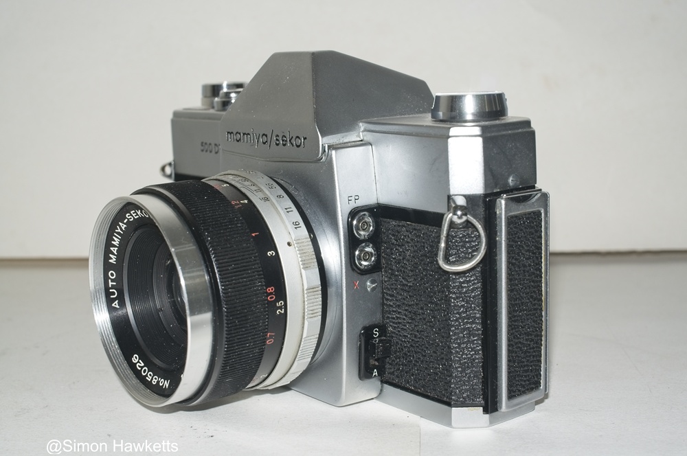 Mamiya/Sekor 500 DTL 35mm SLR camera - Side view showing metering switch and flash sync