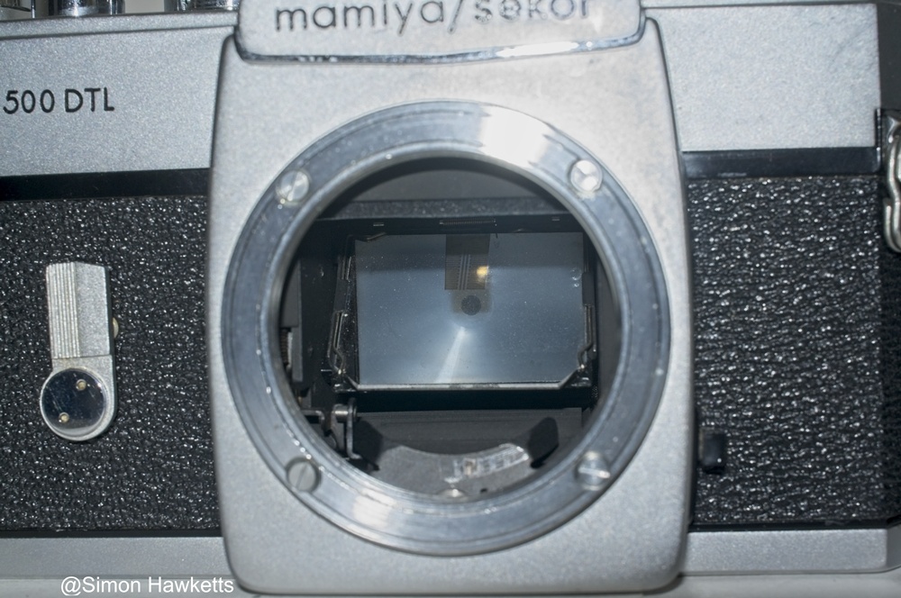 Mamiya/Sekor 500 DTL 35mm SLR camera - Front view showing mirror and Spot Meter sensor