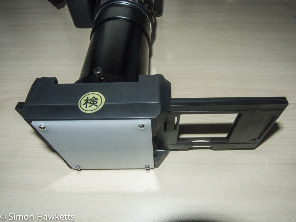 Slide duplicator for 35mm slides showing light defuser
