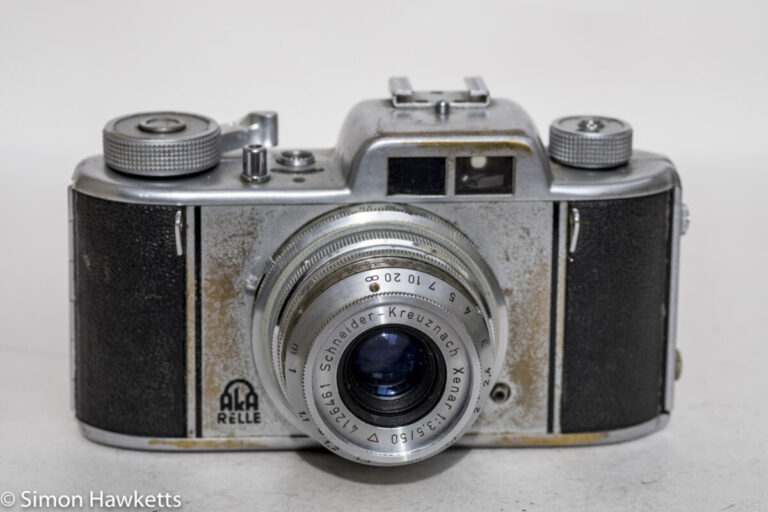 aka-relle-35mm-interchangeable-lens-viewfinder-camera-front-view-of-rather-battered-camera