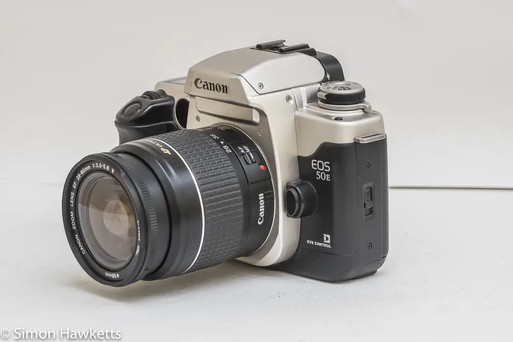 Canon EOS 50e 35mm autofocus camera - side view showing AF/MF switch and lens release