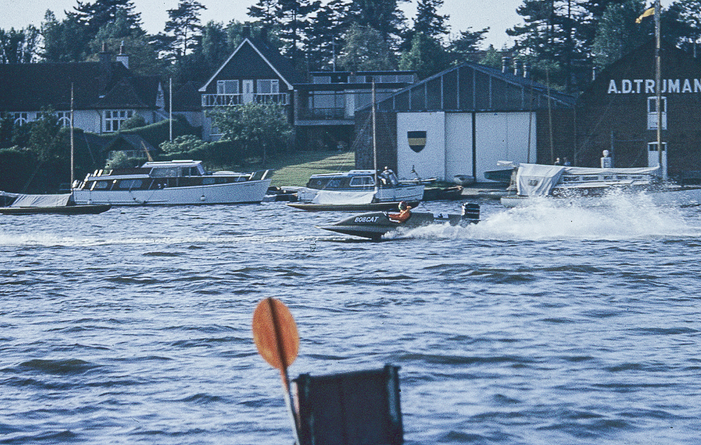 discovered colour slides a speedboat near houses by the coast