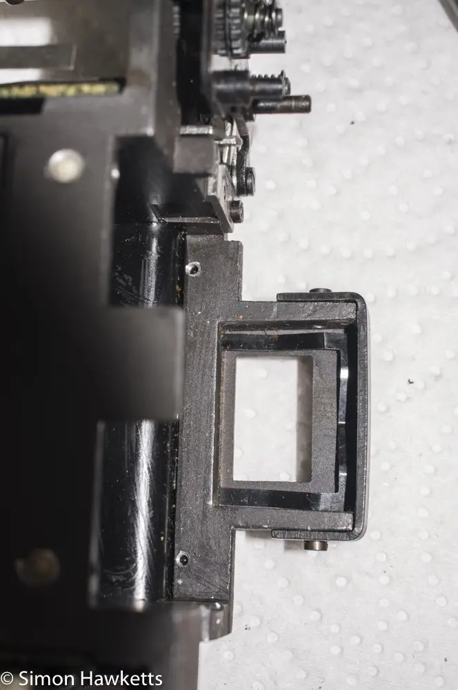 Exakta Exa II shutter repair  - Spring under viewfinder lens