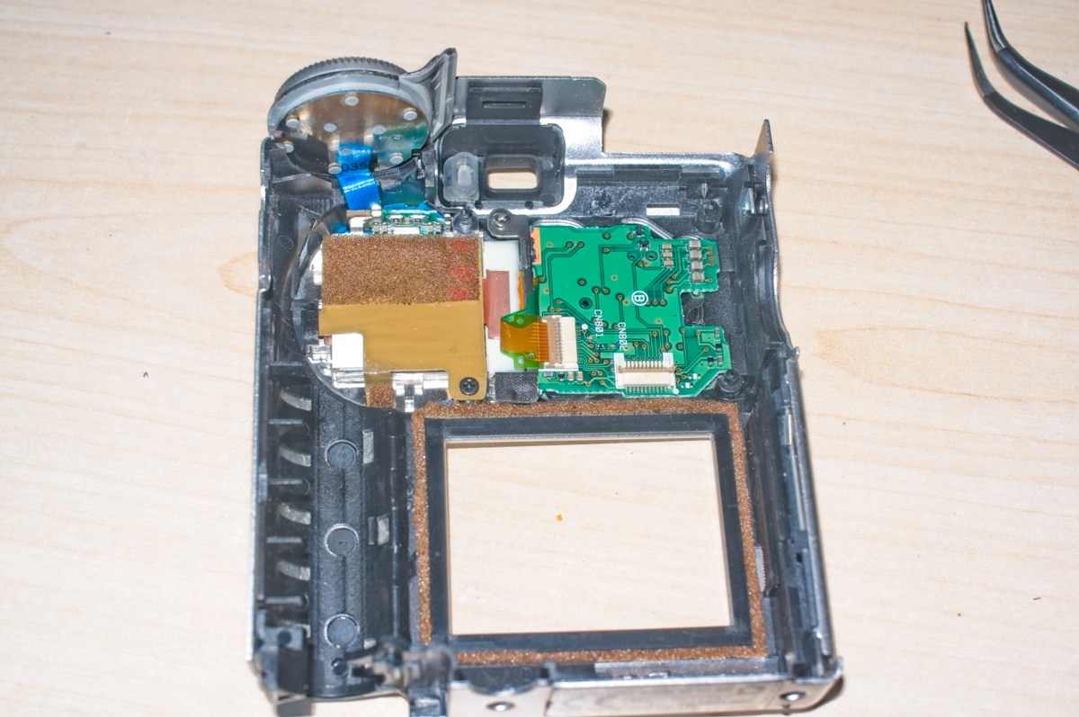 The back panel from a Fuji Finepix 4700 during a strip down procedure