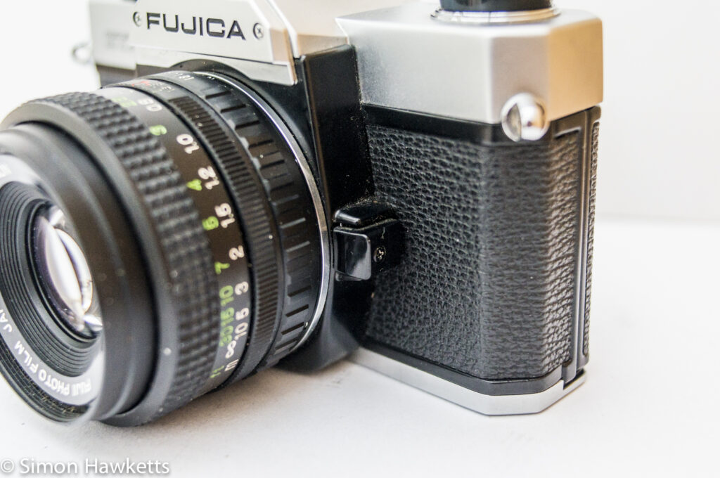 fuji stx 1 35mm slr side view showing lens release