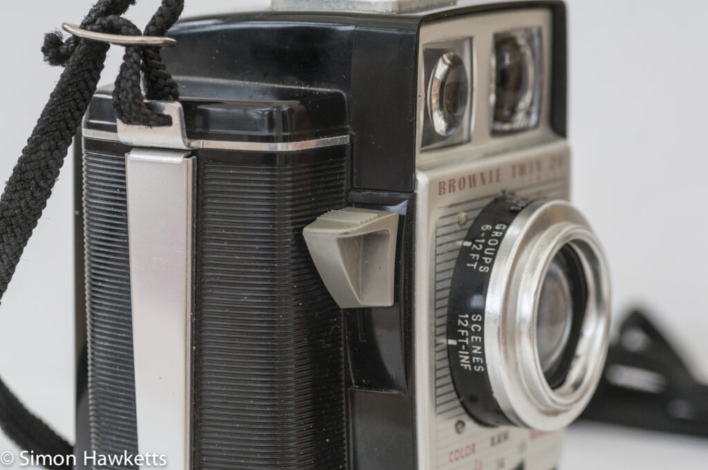 Kodak Brownie Twin 20 roll film camera showing the shutter release lever