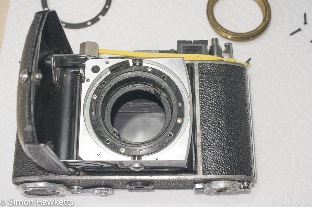 Kodak retina IIc - four black screws removed and focus assembly lifted out