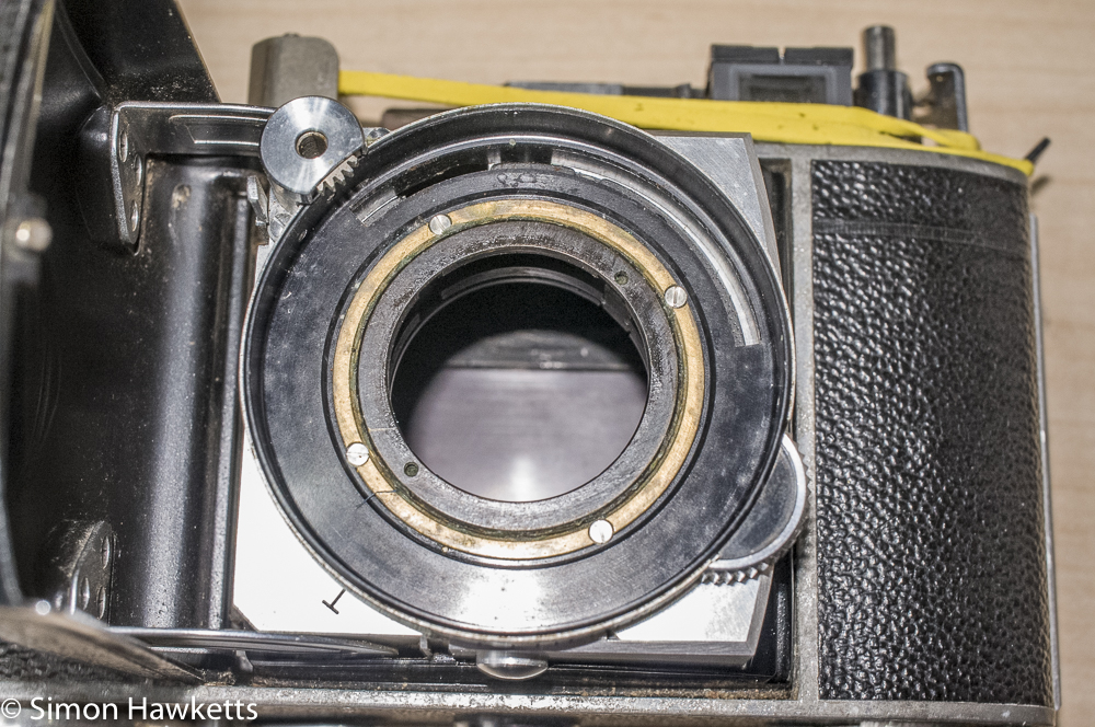 Kodak retina IIc - remove these four screws after scratching a mark across all three pieces
