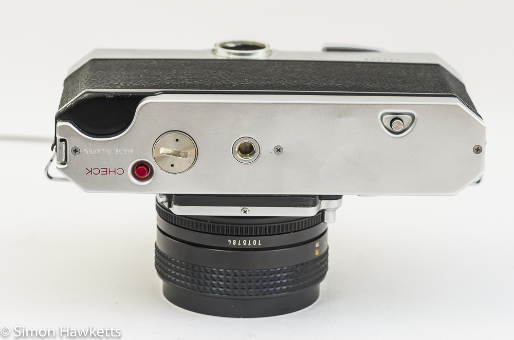 Konica Autoreflex T2 35mm slr bottom view showing battery compartment and check button