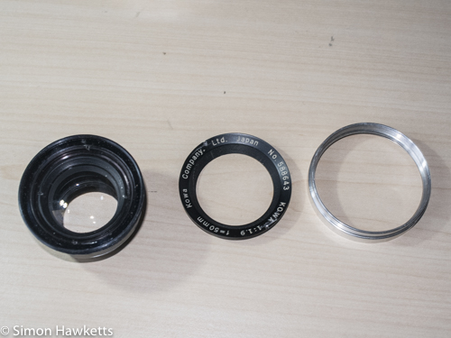 Kowa SE lens & aperture repair - trim, nameplate and lens elements