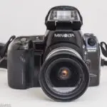 Minolta Dynax 800si autofocus 35mm camera - front view with flash raised