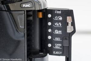 Minolta Dynax 7xi 35mm autofocus slr - Side door open showing extra controls