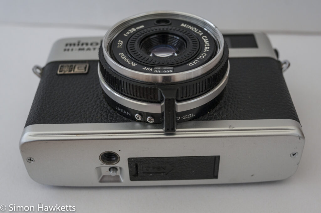 Minolta Hi-Matic F 35mm rangefinder camera showing focus adjust