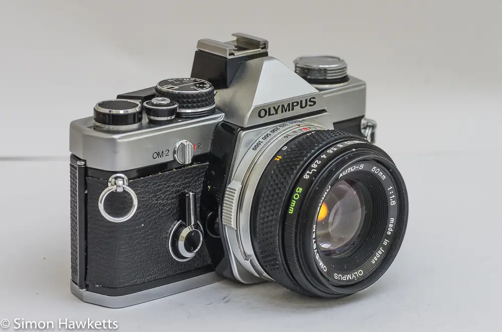 olympus om 2 35mm slr side view showing self timer and shutter speed control