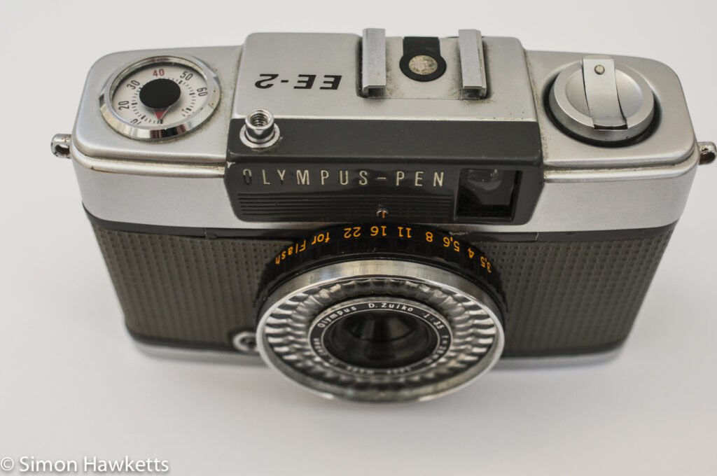 Olympus Pen EE-2 half frame 35mm camera showing aperture setting