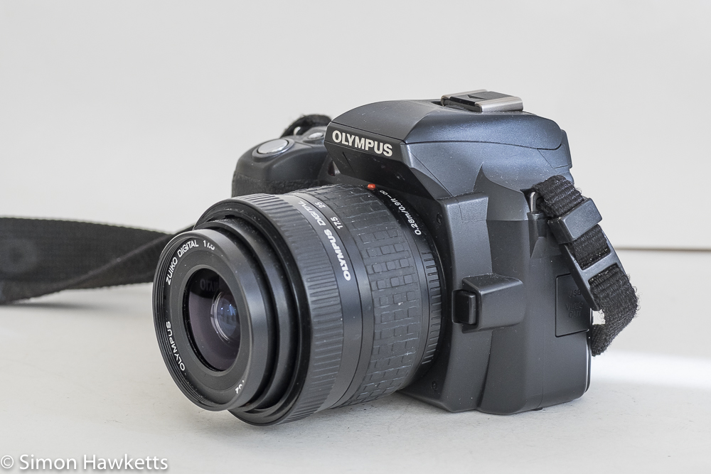 Olympus evolt E500 dslr - side view showing lens release