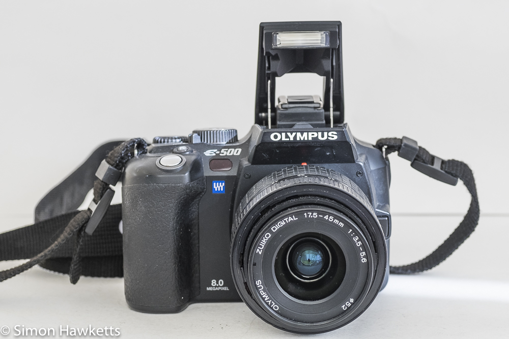 Olympus evoltE500 dslr - front view with flash raised